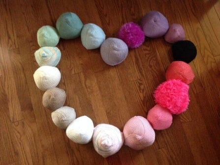 knitted knockers forming a heart