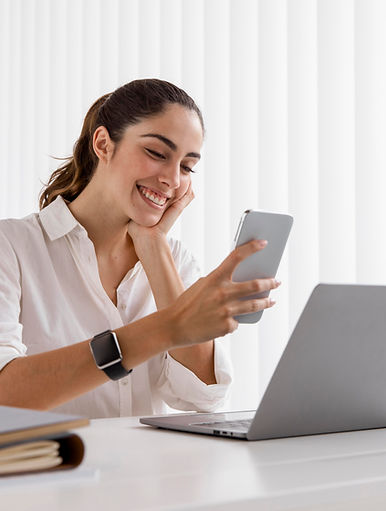 side-view-of-smiley-businesswoman-with-smartphone-and-laptop.jpg