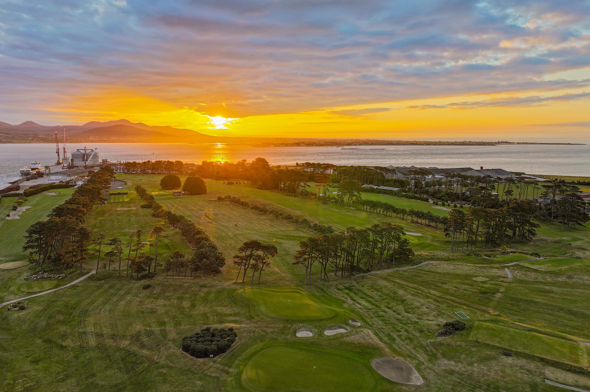 Aerial sunset view over Greenore Golf Club and Carlingford Lough