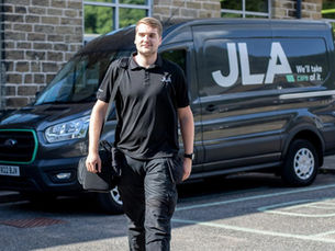 JLA catering engineer entering a building