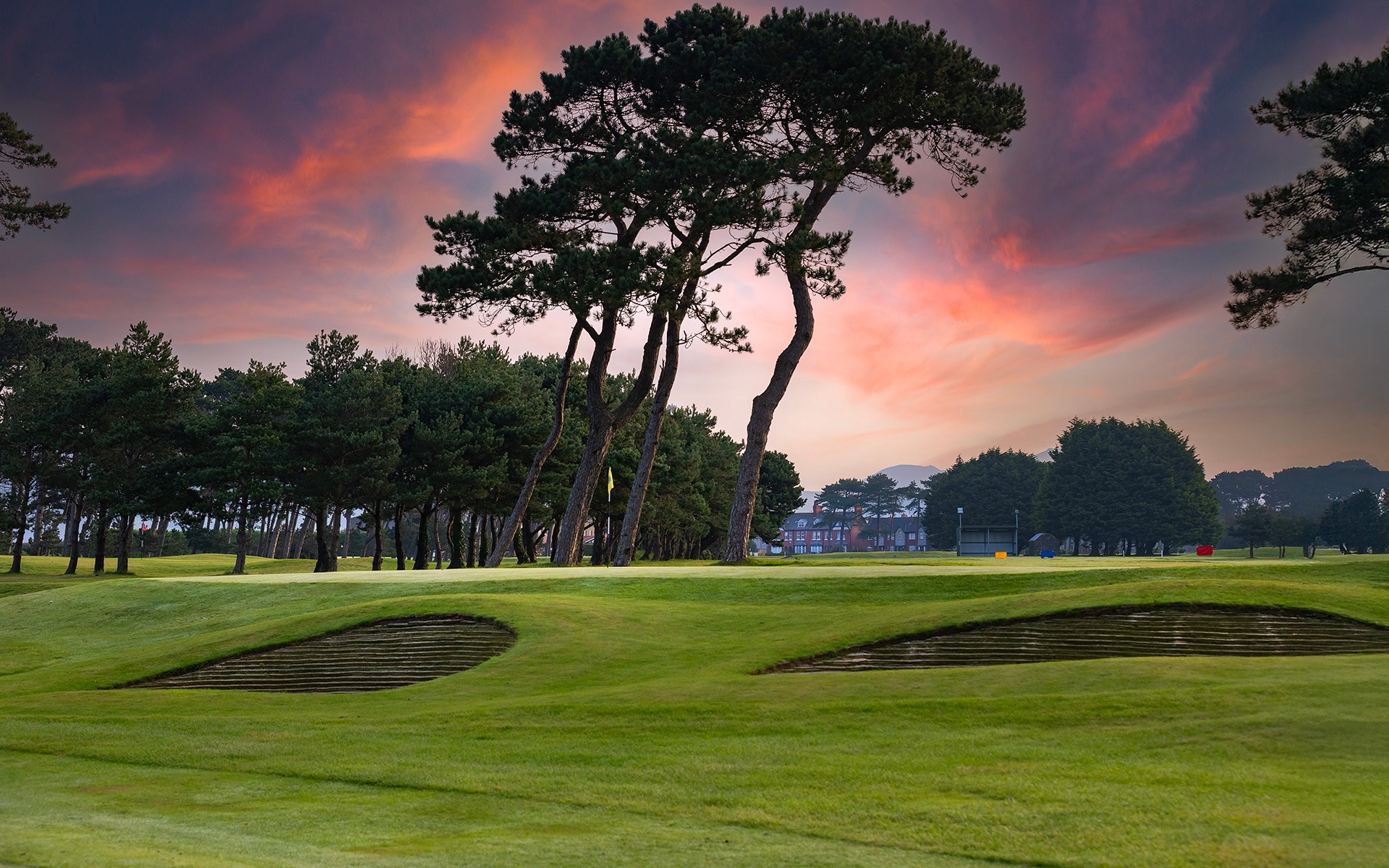 The 14th green at Greenore Golf Club at sunrise on Carlingford Lough