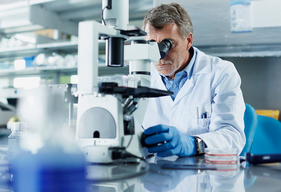 Scientist Using Microscope