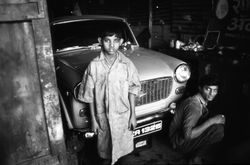 Child worker, garage, India 1994