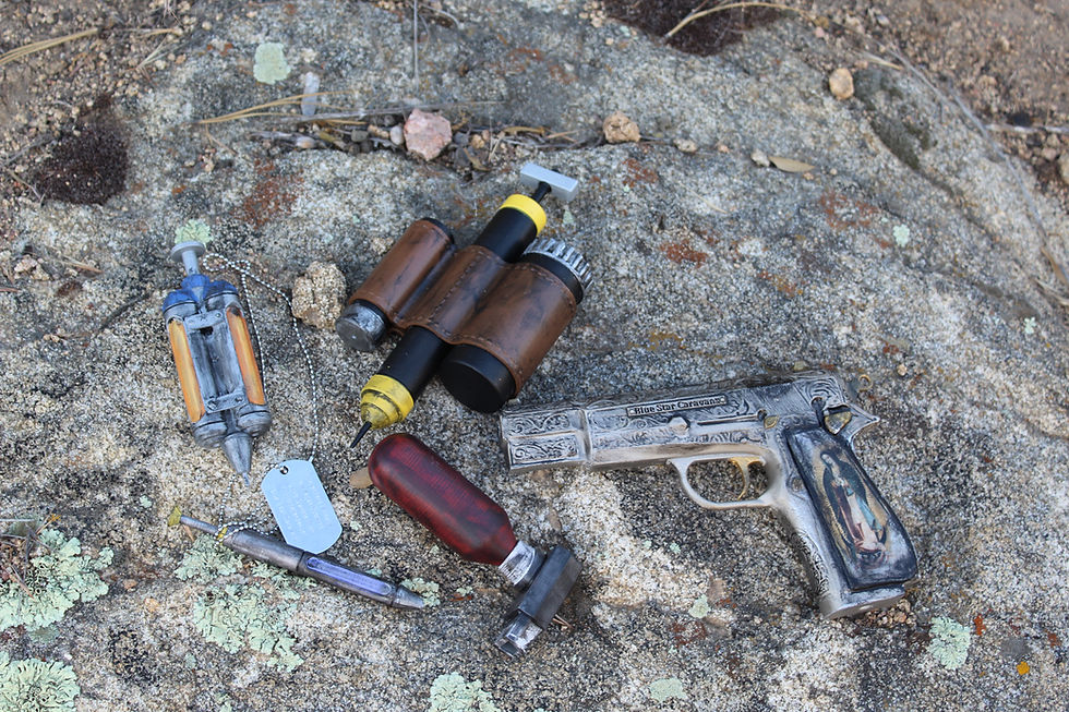 Thumbnail: Wasteland combat gear: pistol, vials, and canisters on rocks