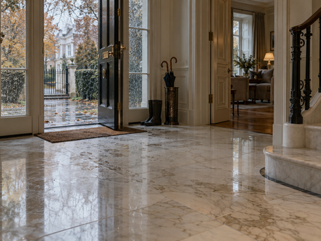 AI-generated illustration of a marble hallway with wet footprints near an entrance on a rainy autumn day.