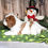 Thumbnail: Adorable Cavalier King Charles Spaniel puppy with snowman
