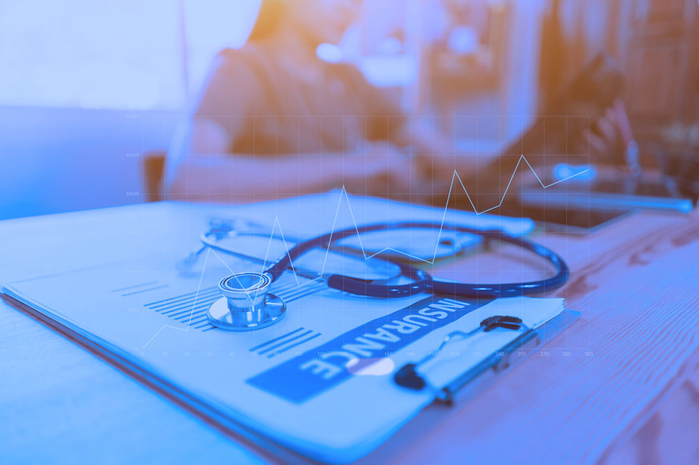 Stethoscope with insurance clipboard and Laptop on desk,Doctor working in hospital writing a prescription, Healthcare and medical concept,test results in background,health care business graph