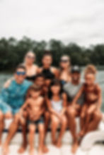 extended family on holiday - wearing swimwear, on a boat