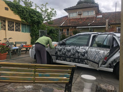 2018. Sandra helping spray the car