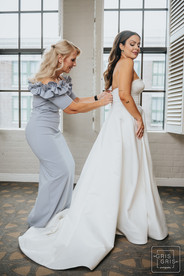 mob helping bride get ready