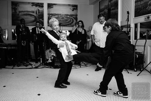 little boy dancing at wedding reception