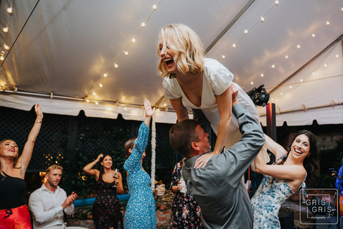 new orleans bride dancing in courtyard of wedding