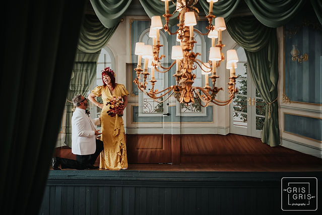bride and groom wedding photo pose on theater stage of peter and Paul hotel in new orleans 