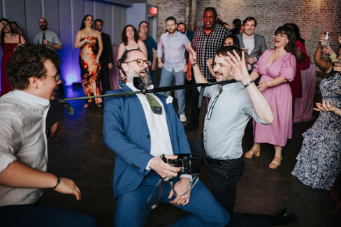 limbo on dance floor of wedding