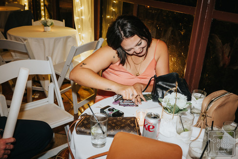 wedding guest scratching lotto ticket