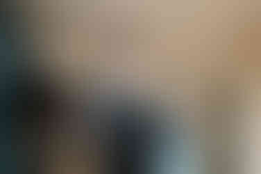 groom getting ready in hotel room at Fontenot