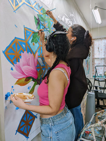 studio assistants painting geometric patterns
