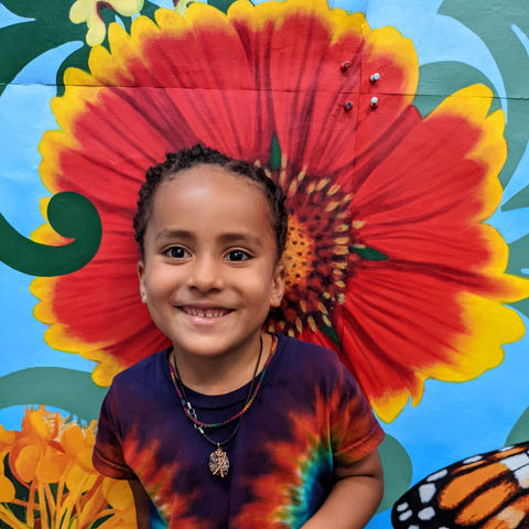 child with beautiful handpainted flower