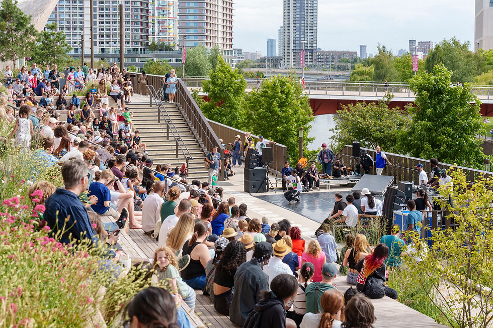 Image: audiences watching hip-hop enjoying the new terraces and public realm planting on the East Bank at Stratford (Courtesy Neil Speakman for LDA Design)