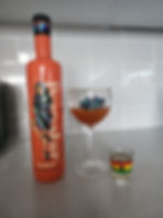 © Lily Naadu Mensah mixes her own Pornstar Martini during an interview with AKADi Magazine