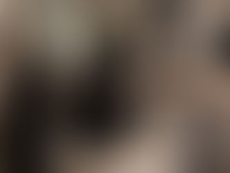 Mother and young child sitting together on a couch in a calm, softly lit living room, reflecting connection, emotional safety, and intentional parenting.