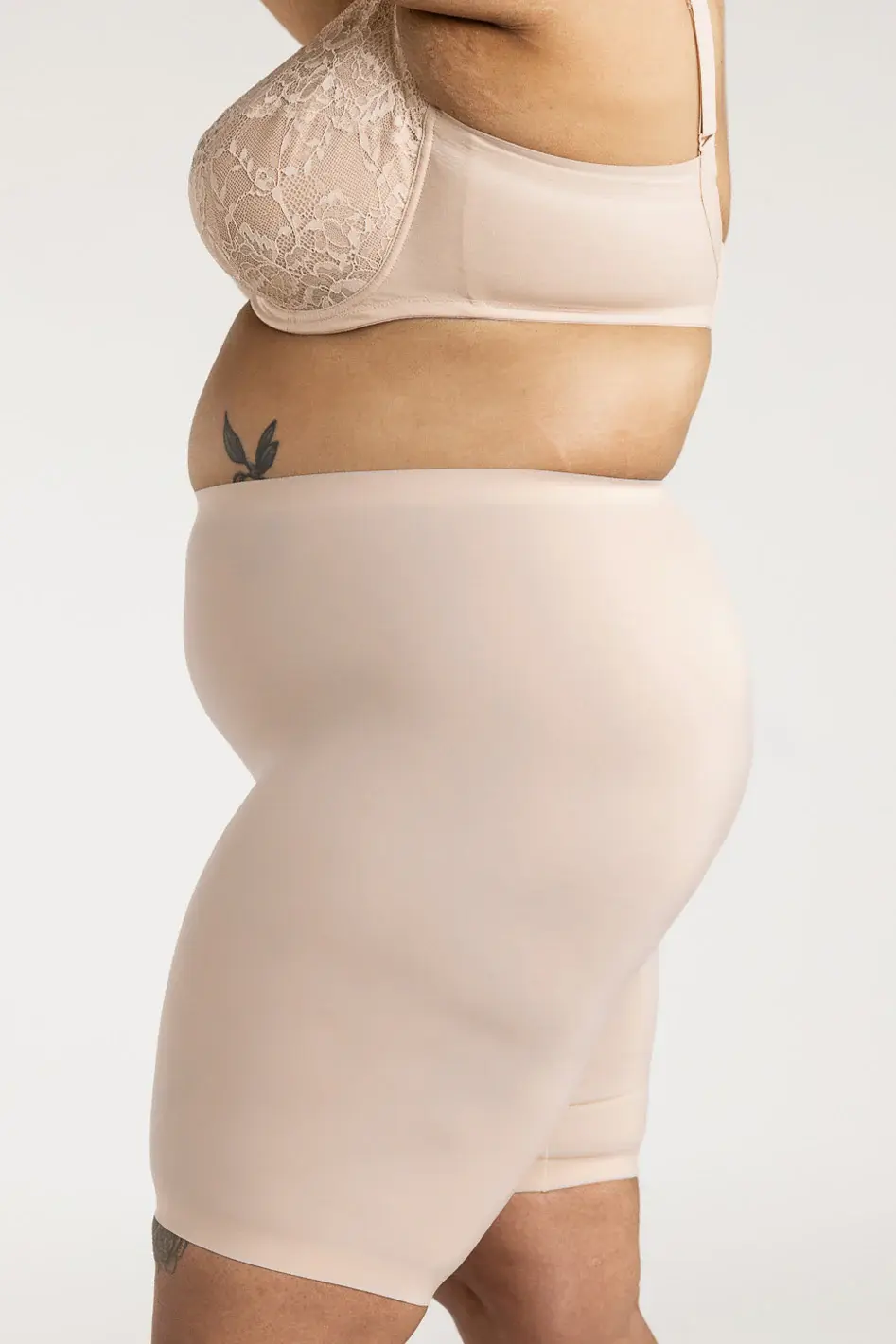 Thumbnail: Understance Soft Contour High-Rise Bike Shorts 7" on model, side view, champagne