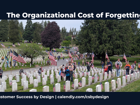 Boy Scouts and families place American flags at headstones during a Memorial Day observance at Evergreen Washelli Cemetery in the Pacific Northwest, with rows of white military headstones extending toward a treeline.