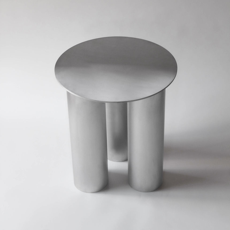 Thumbnail: A raw aluminium metal stool in seen in front of an empty white background