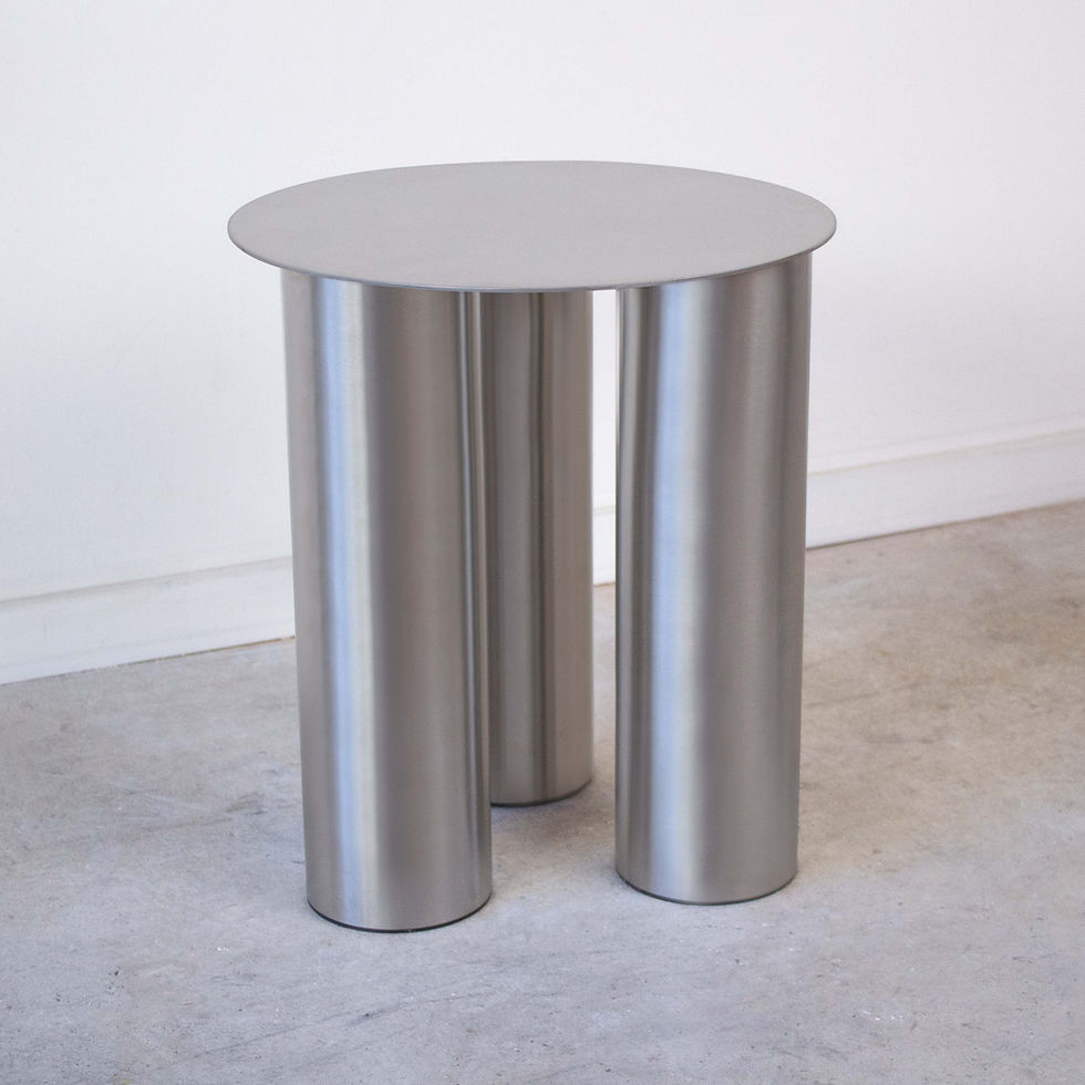 a three legged contemporary stool and side table made from stainless steel