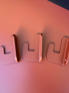 Three red aluminium wall hooks in red "RAL 8015"