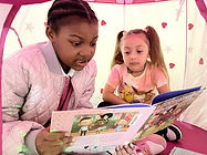 RAAW Gaby Reads to Natasha.jpg