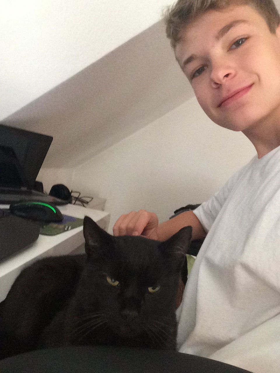 Eric Osterwald with a black cat