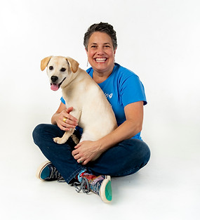 professional Dog trainer Hope Cogen and a yellow labrador puppy