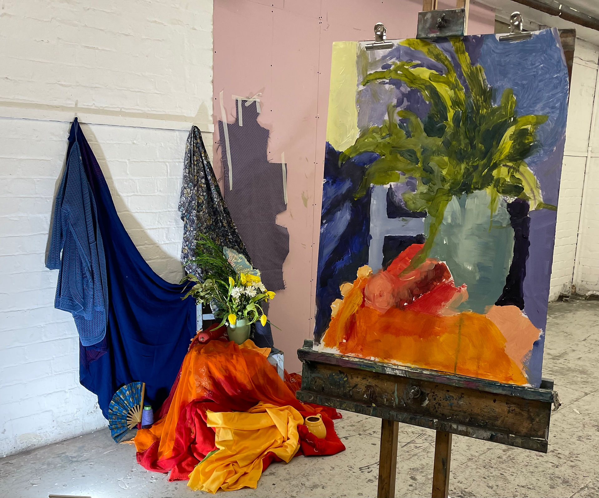 Model within a setup of draped fabrics in blue and yellow Matisse Odelisque Style
