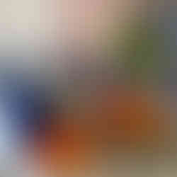 Model within a setup of draped fabrics in blue and yellow Matisse Odelisque Style