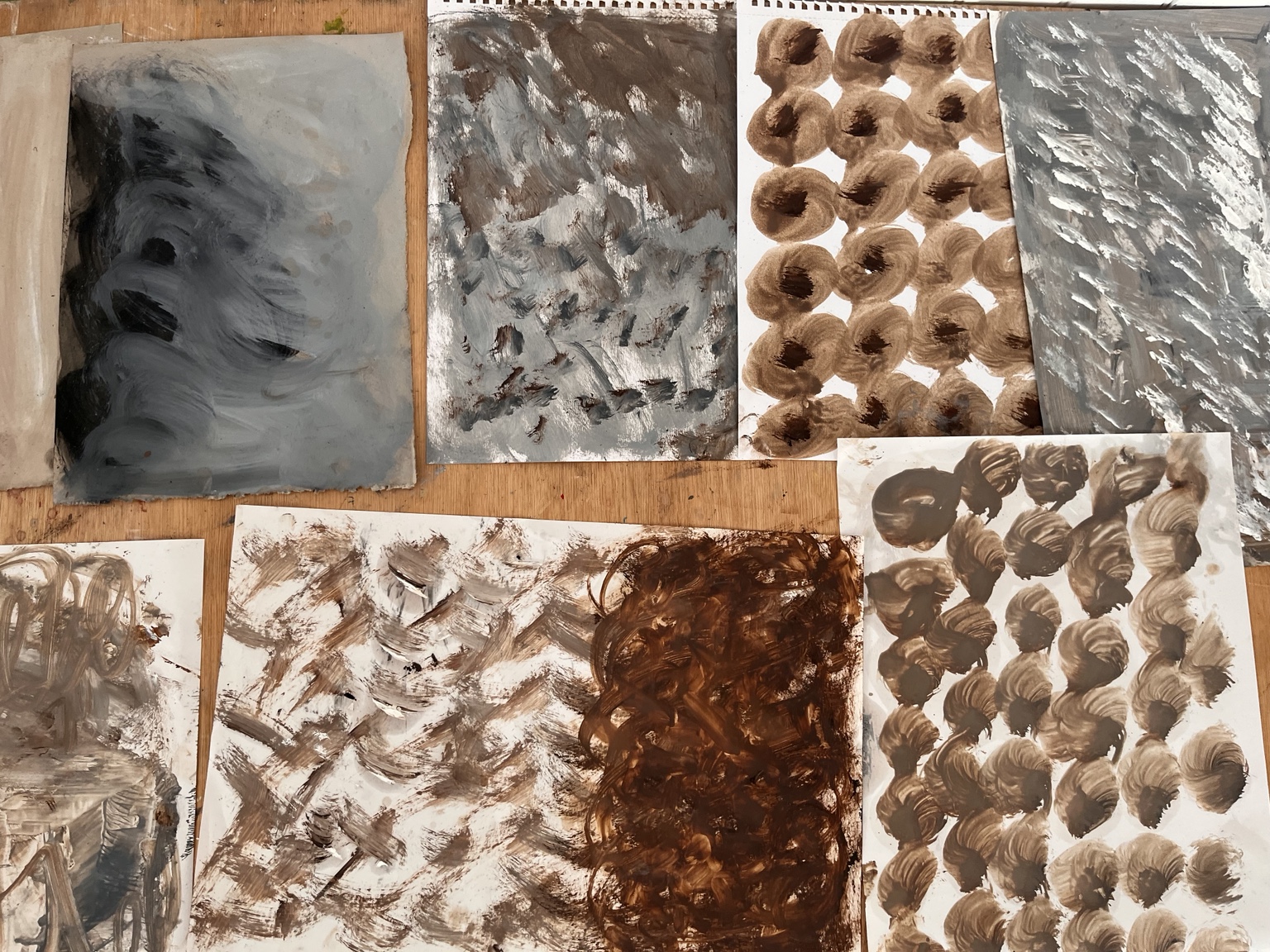 Experimental painted marks and repeated shapes made during the first day of the workshop