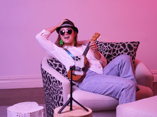 A female model sitting on a swivel chair