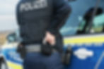 Policeman with handcuffs and bag