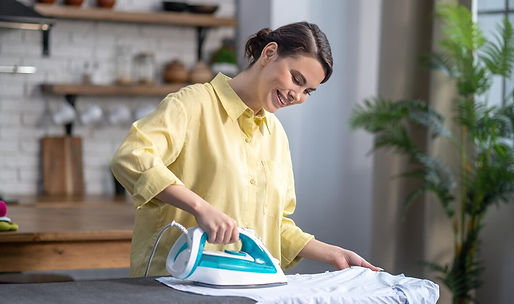 smiling-beautiful-housewife-ironing-wrinkled-shirt_259150-58941.jpg