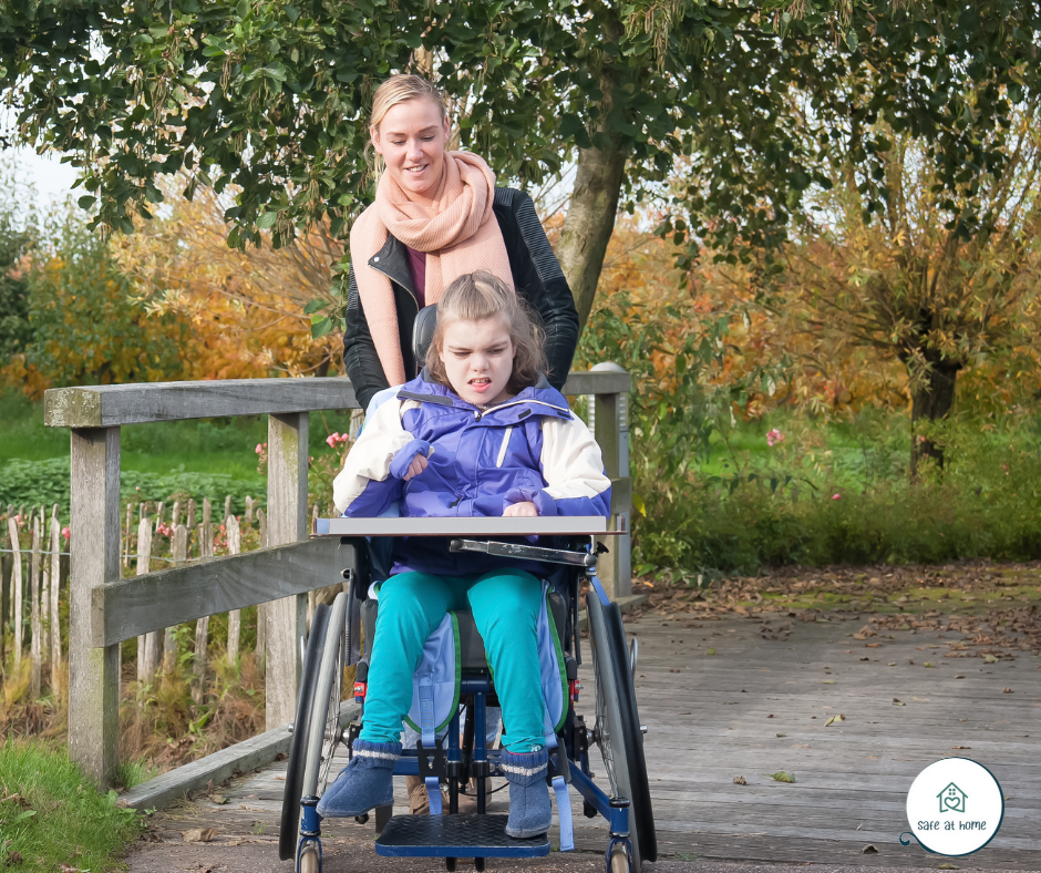 Caregiver assisting a child with mobility and daily activities as part of the LRI program