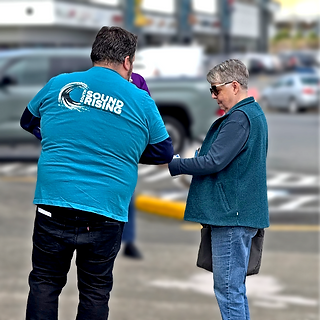 ufcw 367 member talking to a customer outside of a store about their fight for a fair contract