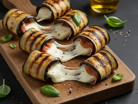 Rotolini di melanzane grigliate con un cuore filante di mozzarella e prosciutto: un'esplosione di gusto in ogni boccone!