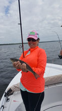 woman catching fish in florida