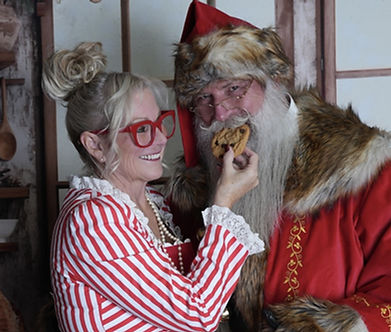 2025 Santa being fed a cookie.jpg