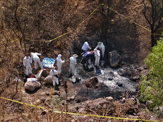 Twelve remains are discovered by police in secret graves in northern Mexico