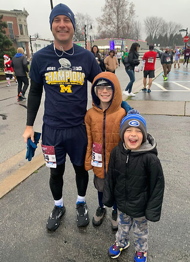 Father and two sons post 5K race