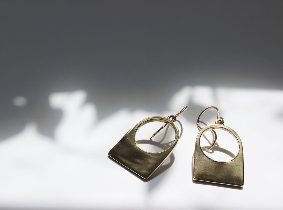 Thumbnail: Go to jewelry on an off-white dappled light background.