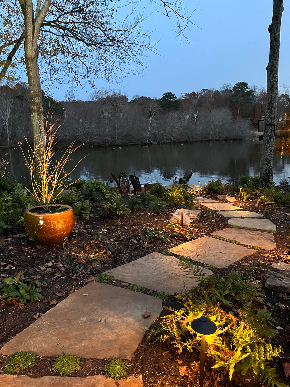 outdoor lighting in a beautifully designed lakeside property