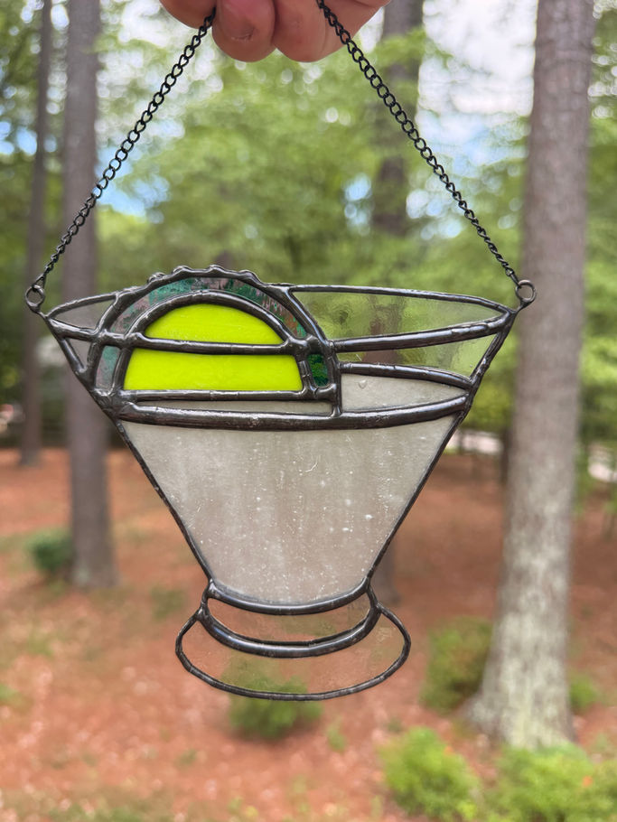 Stained glass daiquiri with lime garnish made from textured white glass