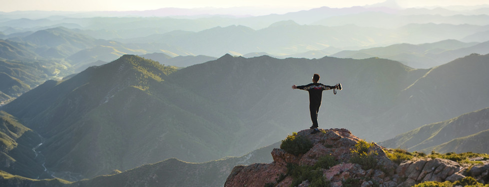 man standing on rock formation during da